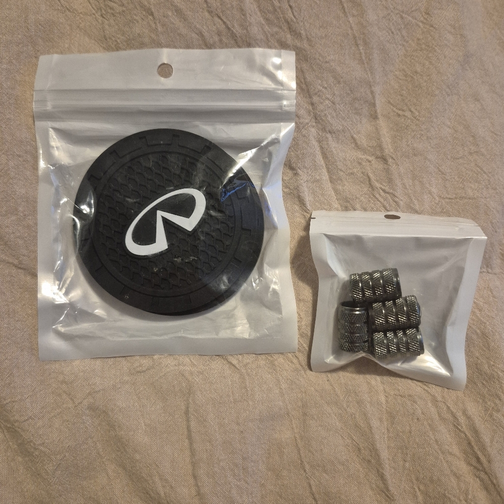NIB Infiniti car rubber coasters & matching valve stem covers.